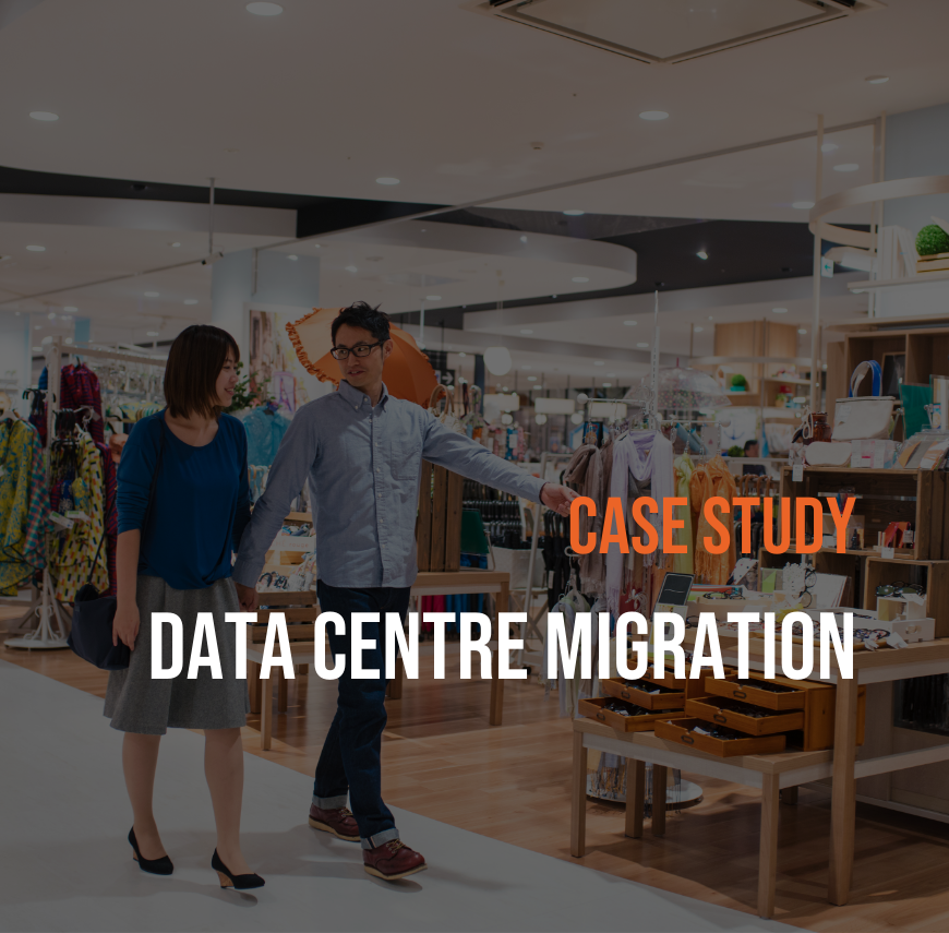 usiness consultant in glasses and blue shirt discussing with female colleague in modern bookstore with shelving displays, featuring "Case Study Data Centre Migration" overlay