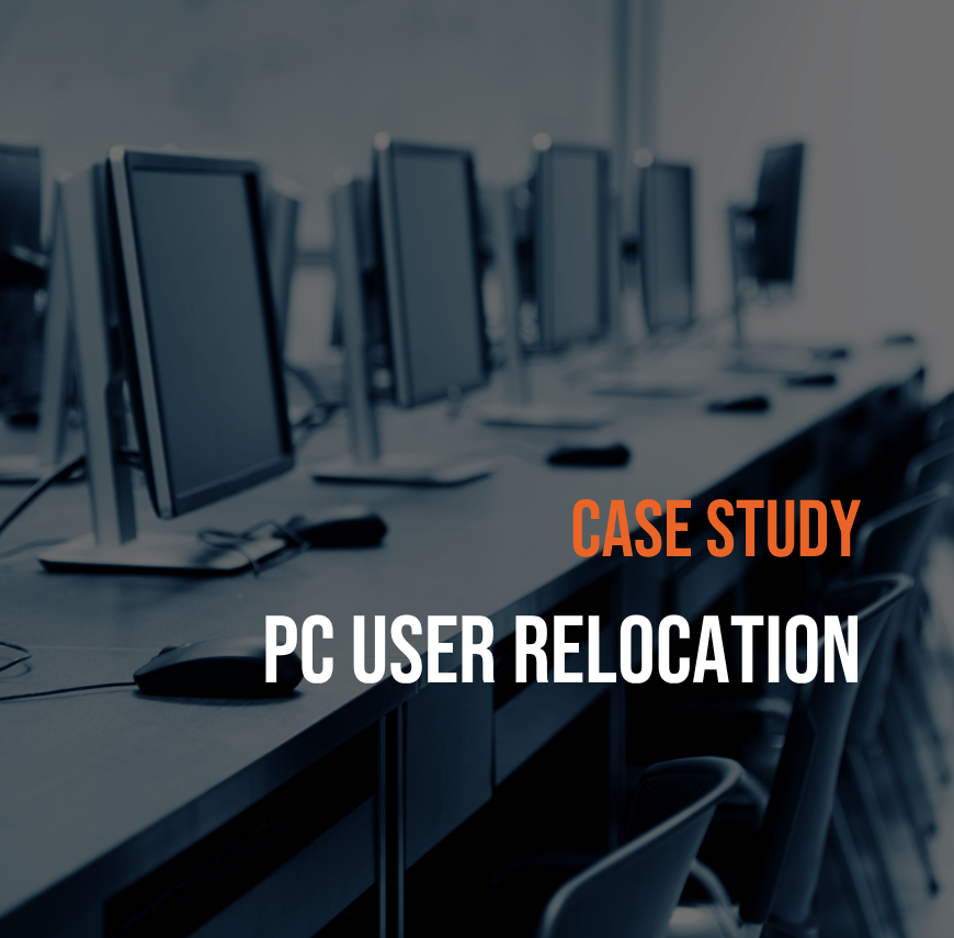 Rows of PC workstations set up on desks in a university learning or working environment.