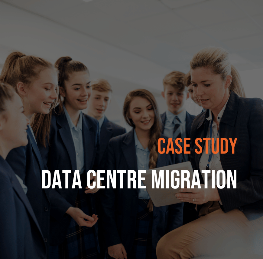 Students in a classroom gathered around a tablet with a teacher reviewing content, overlaid with “Case Study: Data Centre Migration”.